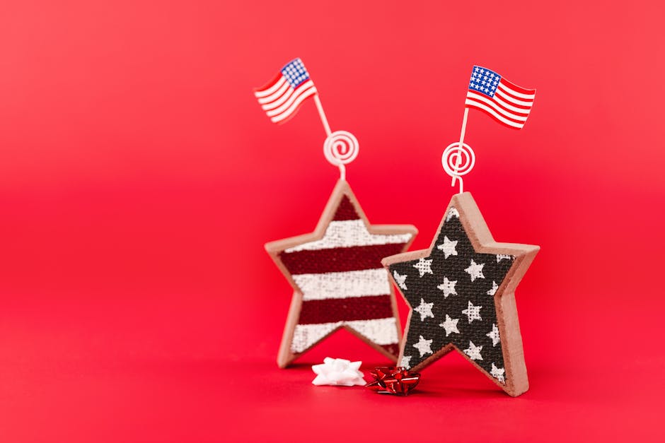 Wooden stars with American flags on red background, perfect for Fourth of July celebrations.
