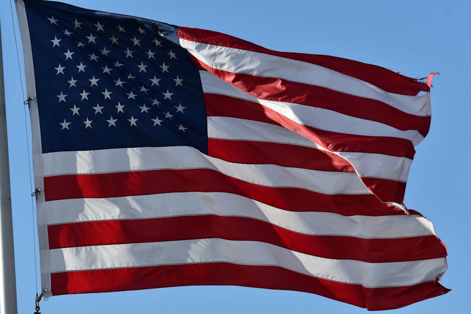Close-up of the USA flag waving outdoors, symbolizing freedom and patriotism.