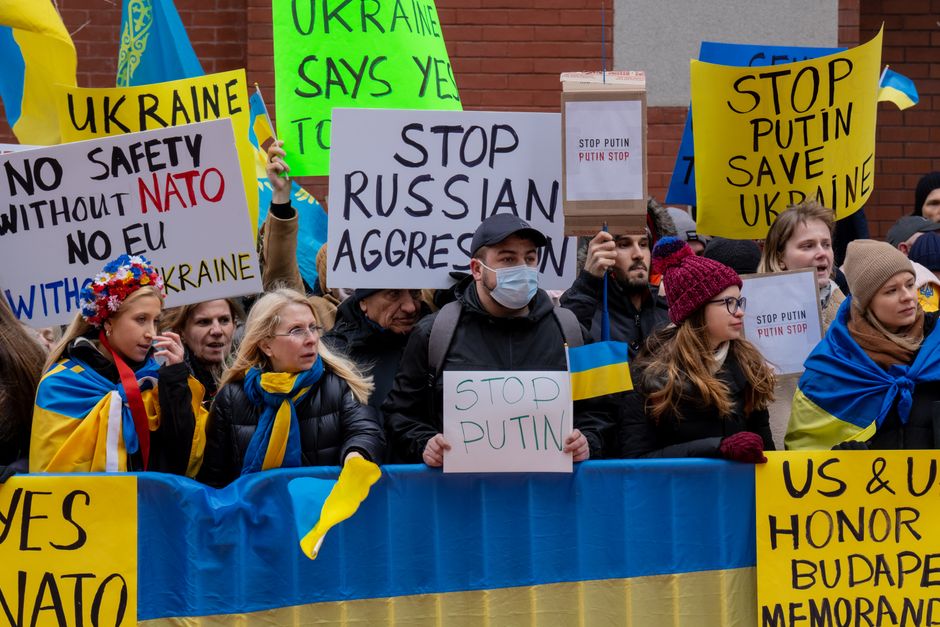 Demonstrators in New York City protest against Russian aggression, advocating for Ukraine's safety.
