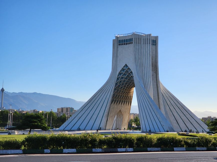 Iconic Azadi Tower in Tehran, Iran, under clear blue skies, perfect for travel inspiration.
